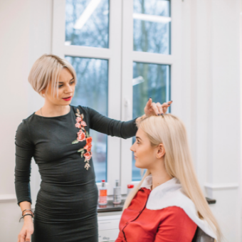 hairdresser consults with client